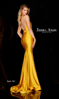 A woman in a gold, backless, floor-length gown poses with her back to the camera. The Asymmetrical Long Prom Dress by Jessica Angel 951 showcases elegant curves and timeless sophistication.