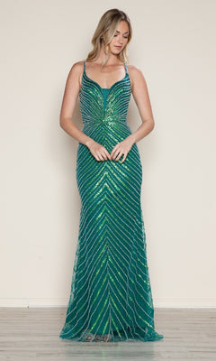 A woman stands indoors wearing the Cut-Out Long Beaded Prom Dress (Poly USA 9530), a sleeveless, floor-length gown with a green and blue chevron pattern adorned with shimmering sequins.