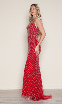 A woman in profile models the Poly USA 9530 Cut-Out Long Beaded Prom Dress— a sleeveless, floor-length red gown with diagonal silver sequin stripes, set against a plain beige background.