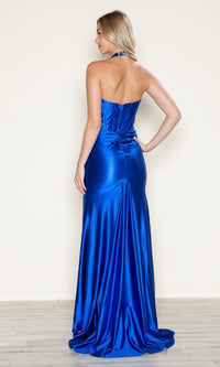 A woman faces away in the Poly USA 9562 Long Corset Halter Prom Dress—a shiny blue, floor-length gown with a subtle back bow—an elegant and affordable formalwear choice.