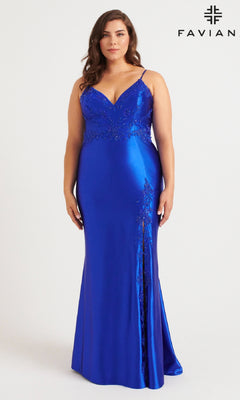 A woman models the Faviana 9562 Long Plus-Size Prom Dress in royal blue satin with lace details, thin straps, a V-neckline, and a side slit. "FAVIANA" is displayed in the top right corner.