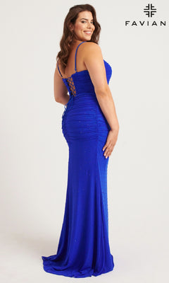 A woman wears the Faviana 9567 Lace-Up Plus-Size Long Prom Dress in royal blue, featuring thin straps, back lacing, subtle embellishments, and a graceful floor-length skirt as she stands sideways and smiles.