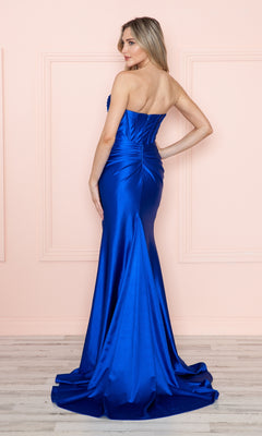 A woman wearing the Strapless Keyhole Long Prom Dress (Poly USA 9574), featuring a fitted corset-style bodice, stands with her back to the camera against a light pink wall.