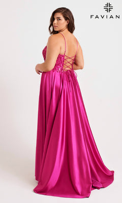 A woman faces away in the Faviana 9582 long plus-size prom dress, featuring a bright pink satin finish, fitted bodice, lace-up back, and flowing skirt. The brand name “Faviana” is displayed in the top right.