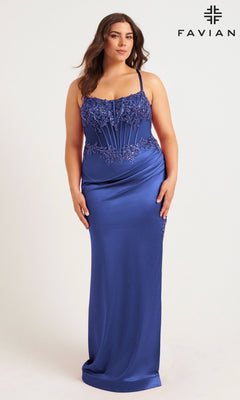 A woman in the Long Plus-Size Prom Dress Faviana 9592 stands against a plain background; she wears a fitted royal blue gown with a beaded corset bodice and thin straps, with the Faviana logo visible.