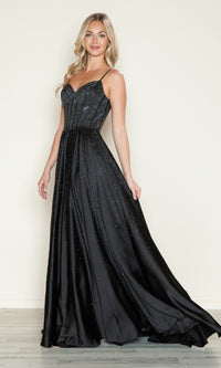 A woman wearing the Poly USA 9610 Long Prom Dress, a sleeveless black gown with a corset bodice and subtle sparkling beading, stands against a plain background.