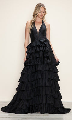 A woman in a black Ruffled Long Halter Prom Dress (Poly USA 9642) with a deep V-neck and layered ruffles stands against a plain beige background.
