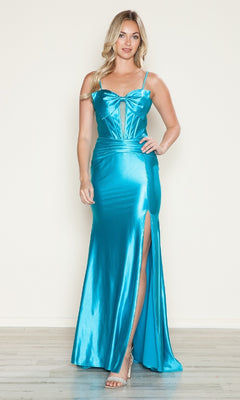 A woman wears the Front-Bow Long Cut-Out Prom Dress (Poly USA 9644), a shiny turquoise gown with a corset silhouette, front bow, thin straps, and thigh-high slit, standing on a light wood floor against a plain background.