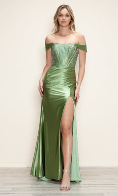 A woman stands indoors by a plain light wall, wearing the Off-Shoulder Long Corset Prom Dress Poly USA 9656, featuring a shiny finish, beaded corset, high slit, and off-the-shoulder style.