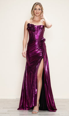 A woman models the Strapless Long Metallic Prom Dress: Poly USA 9682 in shiny magenta, featuring floral accents and a thigh-high slit, standing against a plain light background.