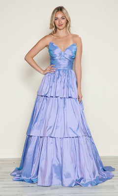 A woman stands against a plain background, wearing the Poly USA 9694 long prom dress in shiny light purple, featuring a fitted bodice, spaghetti straps, and tiered A-line layers.