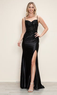 A woman with light hair smiles indoors, wearing the Poly USA 9710 long prom dress featuring an embroidered corset bodice, thin straps, sparkling embellishments, and a daring leg slit.