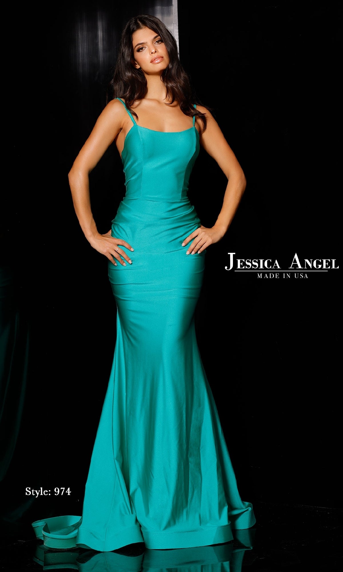 A woman wears the Jessica Angel 974 Open-Back Long Prom Dress, a turquoise fitted style with thin straps and mermaid skirt, labeled 