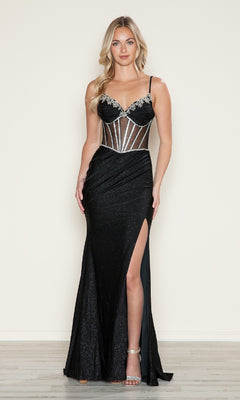 A woman in the Sheer-Corset Glitter Prom Gown (Poly USA 9748)—a black mermaid dress with a beaded corset bodice, thin straps, silver accents, and a thigh-high slit—stands against a plain background.