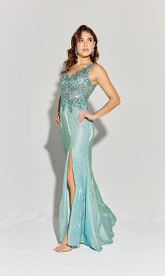 A woman stands against a plain light background wearing the Lace-Bodice Long Glitter Prom Dress: Eureka 9810—a sleeveless, floor-length blue-green gown with a floral lace bodice and slit.