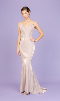 A woman wears the Long Prom Dress: Eureka 9811 in rose gold, with thin straps, subtle sparkles, and a mermaid silhouette against a lavender background.
