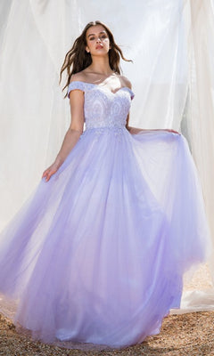 A woman outdoors wears the Off-Shoulder Glitter Prom Ball Gown Eureka 9899, a light purple dress with lace and tulle details, holding one side of the skirt.