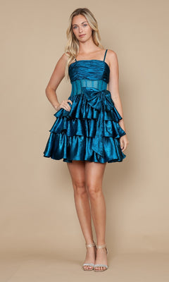 A woman poses against a beige background in the Ruffled Short Satin Hoco Dress: Poly USA 9902, a teal sleeveless mini dress with ruffles, styled with silver high-heeled sandals.