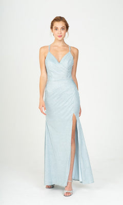 A woman stands facing forward in the Long Prom Dress: Eureka 9933 in Ice Blue, featuring thin straps, a thigh-high slit, and silver heels against a plain white background.