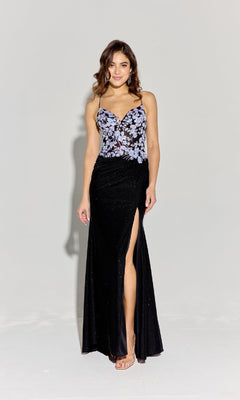 A woman wears the Eureka 9969 Floral-Bodice Long Glitter Prom Dress, a black floor-length gown with a high slit, fitted bodice with purple floral embroidery, and thin straps.