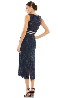 A woman stands in profile against a white background, wearing the Mac Duggal 10509 Short Sequin Wedding Guest Dress and black high-heeled sandals.