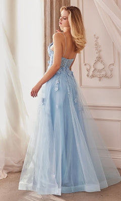 Woman in the Floral-Embroidered Long A-Line Prom Gown A1191, a light blue, floor-length dress with floral embroidery and applique, standing in an elegant room with white walls and ornate molding.