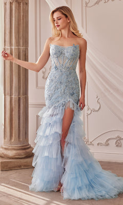 A woman stands indoors wearing the Strapless Fitted Ruffle Prom Dress A1255 in light blue lace and tulle, featuring a strapless mermaid silhouette, ruffle tulle skirt, and high slit.
