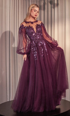 A woman wears the Sheer Long Sleeve Long Formal Dress A1263, a floor-length purple gown with off-the-shoulder design, sheer sleeves, and sequin embellishments, set against light-colored draped curtains.