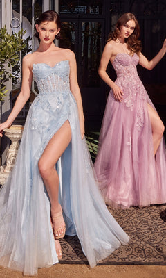 Two women pose outdoors in Andrea & Leo A1378 strapless long prom dresses, one light blue and one light pink. Both feature floor-length skirts with high slits, embroidered floral lace, and sheer bodices for an elegant look.
