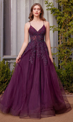 A woman stands outside wearing the Andrea & Leo A1416 Lace-Up Long A-Line Prom Dress in deep purple, featuring a fitted bodice, thin straps, and embroidered floral details.