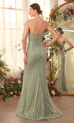 A woman wearing the Strapless Long Fan Prom Dress, Andrea & Leo A1436—mint green with glittering diagonal stripes—stands with her back to the camera in a flower-filled room featuring a large mirror.