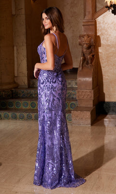 A woman in the Nox Anabel A1583 Long Sequin-Print Prom Dress stands indoors on a marble floor, facing slightly away from the camera.