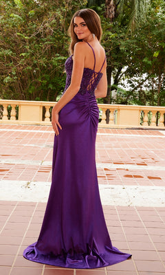 A woman in the Long Beaded-Corset Prom Dress Nox Anabel A1585, a floor-length purple gown with a beaded bodice, stands outdoors on a tiled terrace, facing away and glancing over her shoulder.