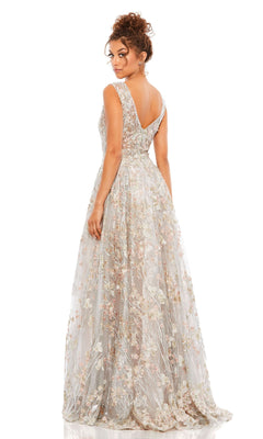 Woman in the Mac Duggal A20131 Embroidered Long Formal Dress, sleeveless and floor-length with floral embroidery, stands with her back to the camera against a white background.