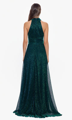 A woman is seen from the back wearing the Empire-Waist High-Neck Long Shimmer Prom Dress A24948 in emerald green, featuring a floor-length design, fitted waist, sleeveless cut, halter neckline, and a shimmery finish.
