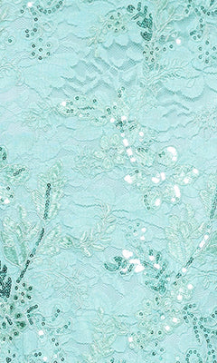 The Betsy and Adam A26885 Long Formal Dress features light blue lace with floral embroidery and sequin embellishments, creating a delicate, shimmering look ideal for formal occasions.