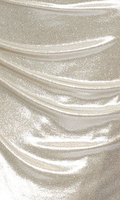 Close-up of shimmering metallic fabric draped in soft folds—ideal for an off-the-shoulder look or the Champagne Long Formal Dress: Betsy & Adam A26921.