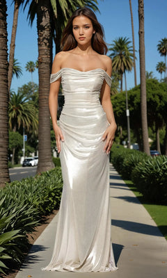 A woman in a Betsy & Adam A26921 Champagne Long Formal Dress stands on a palm tree-lined sidewalk on a sunny day.
