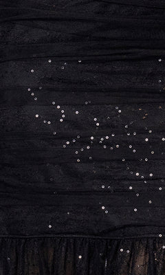 Close-up of the Long Formal Dress: Betsy and Adam A26972 in black, showcasing ruched fabric, small sequins scattered throughout, and a gathered tulle trim at the hem.