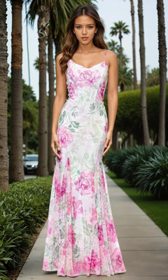 A woman wearing a Betsy and Adam A27020 long ivory print prom dress stands on a palm-lined sidewalk.