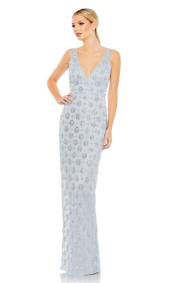 A woman poses with one hand on her hip in a sleeveless, floor-length Mac Duggal 93744 V-Neck Long Beaded Formal Dress in light blue, featuring a deep V-neckline and floral embellishments.