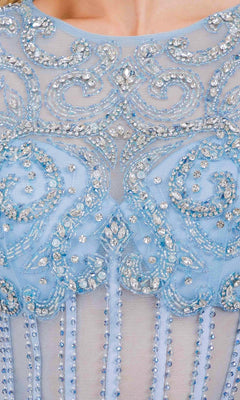 Close-up of a light blue dress with intricate beadwork and embroidery.