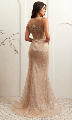 Woman modeling the back of a sparkly gold evening gown with a plain background