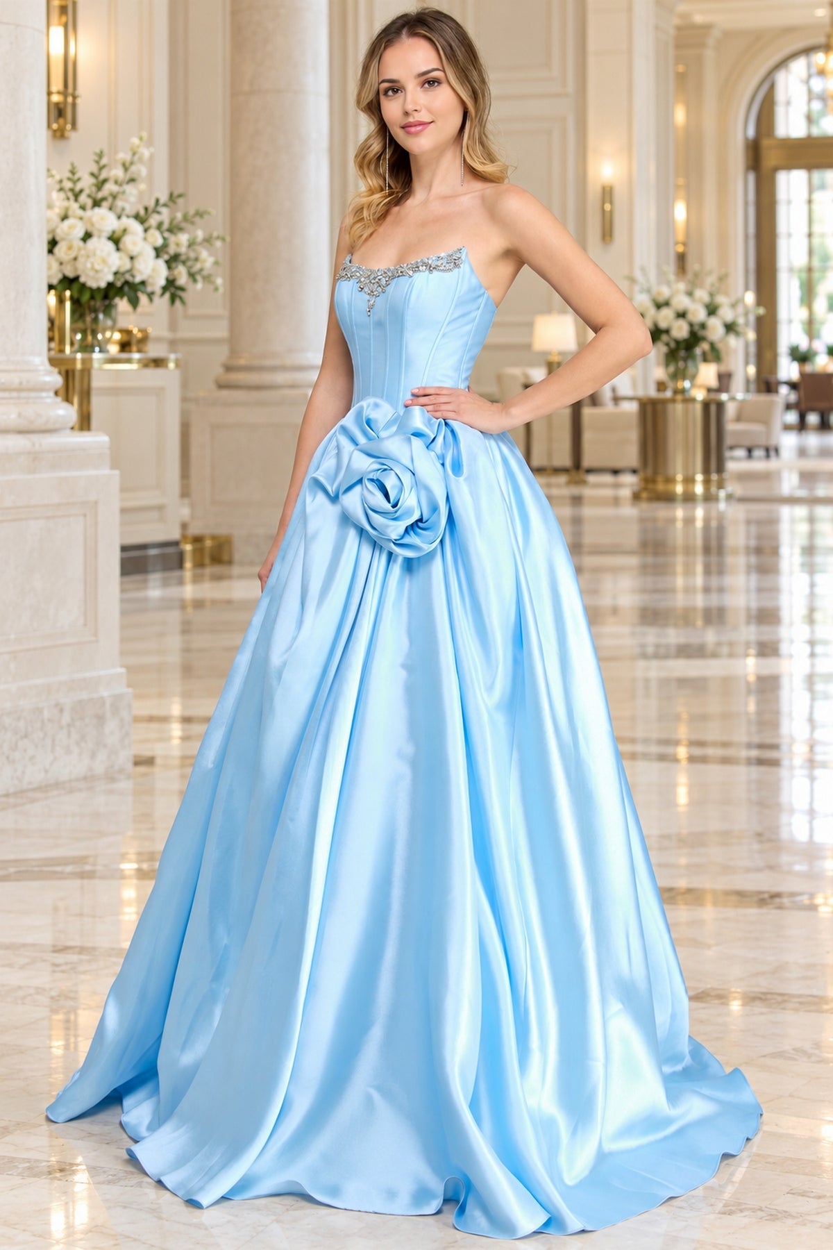 Baby blue strapless corset ball gown with rhinestone neckline embellishments, a large fabric flower at the waist, and Amelia Couture AL1401 styling.