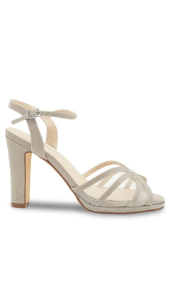 The Anya Champagne Glitter Prom Shoes (Touch Ups 4668) feature a beige glitter finish, open toe, multiple thin straps, ankle buckle strap, and block heel for added height—a chic and elegant choice for prom.