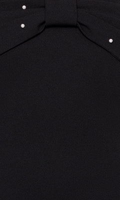 Close-up of the Off-Shoulder Black Hoco Dress: Blondie Nites BC174, featuring a short design with a bow-like top and metallic stud accents at the corners.