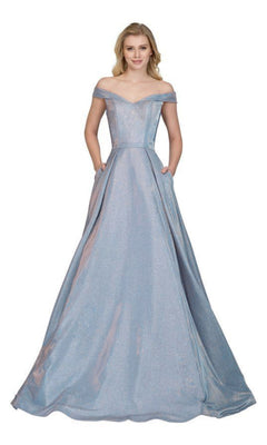 A young woman poses against a white background in the Chicas BT9017 Off-Shoulder Long A-Line Prom Dress, a light blue gown with pockets and a flowing, floor-length silhouette.
