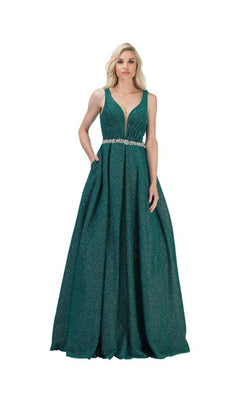 A woman wears the Bead-Waist Long Glitter Prom Dress: Chicas BT9027, a sleeveless emerald green gown with a V-neckline and jeweled waistband, standing against a white background.
