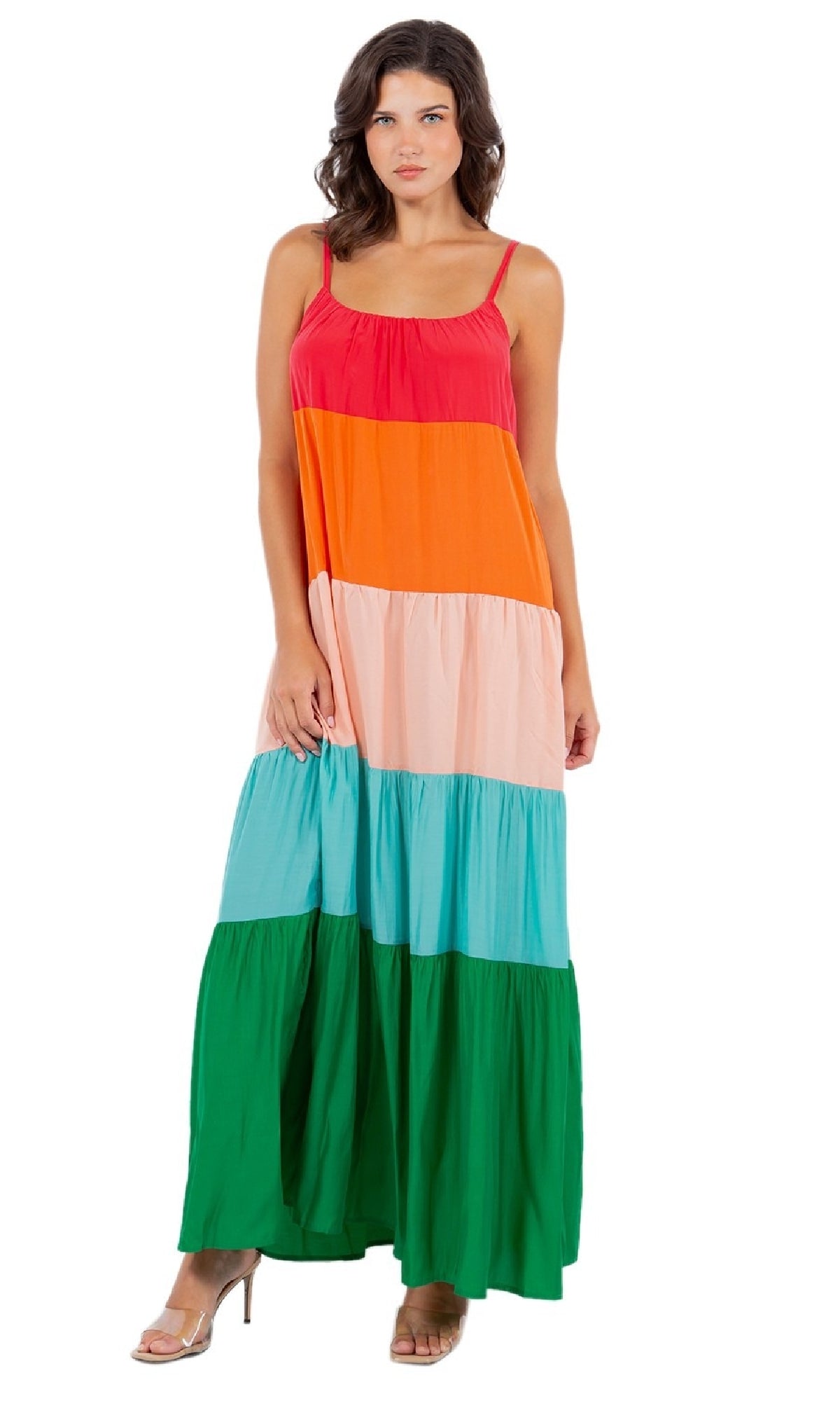 A woman models the Casual Color-Block Maxi Shift Dress, a sleeveless maxi with bold stripes of red, orange, pink, blue, and green, paired with nude heels against a plain white background.