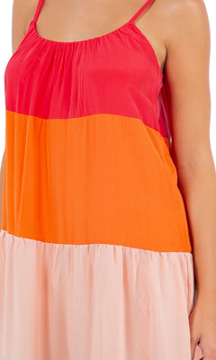 A person is shown wearing the Casual Color-Block Maxi Shift Dress, featuring red, orange, and light pink sections. Only their torso and upper arm are visible.
